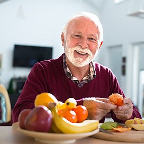 A senior man eating healthy fruits