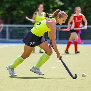 Closeup of woman playing field hockey