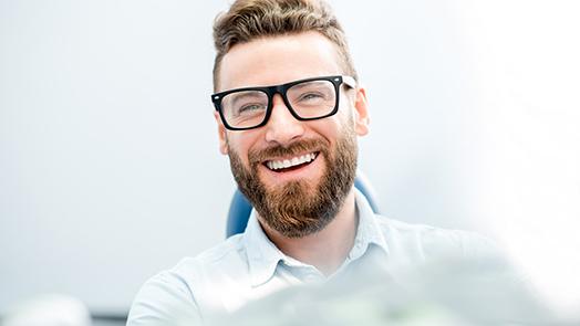 patient smiling after getting root canal 